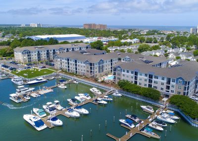drone shot of waterfront apartment community